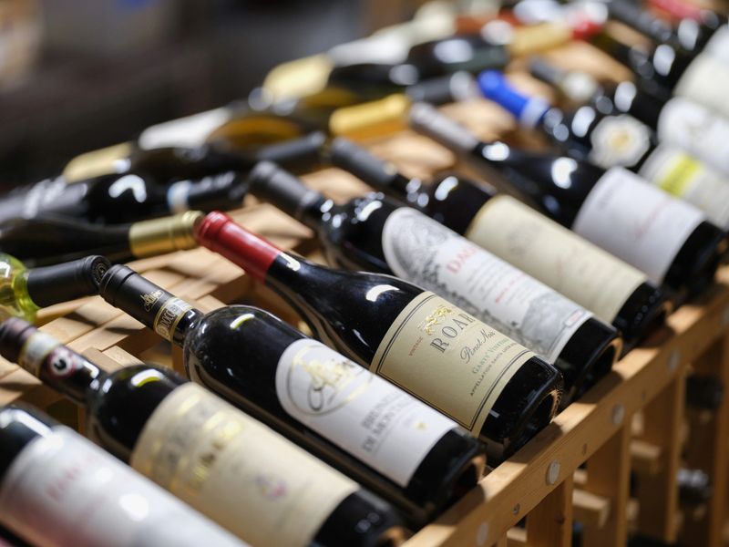 A curated collection of wine bottles on display at Alfredo's Pastaria and Mozzarella Bar.