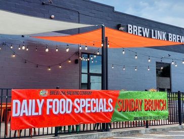 Banner advertising daily food specials and Sunday brunch at Brew Link Brewing Company.