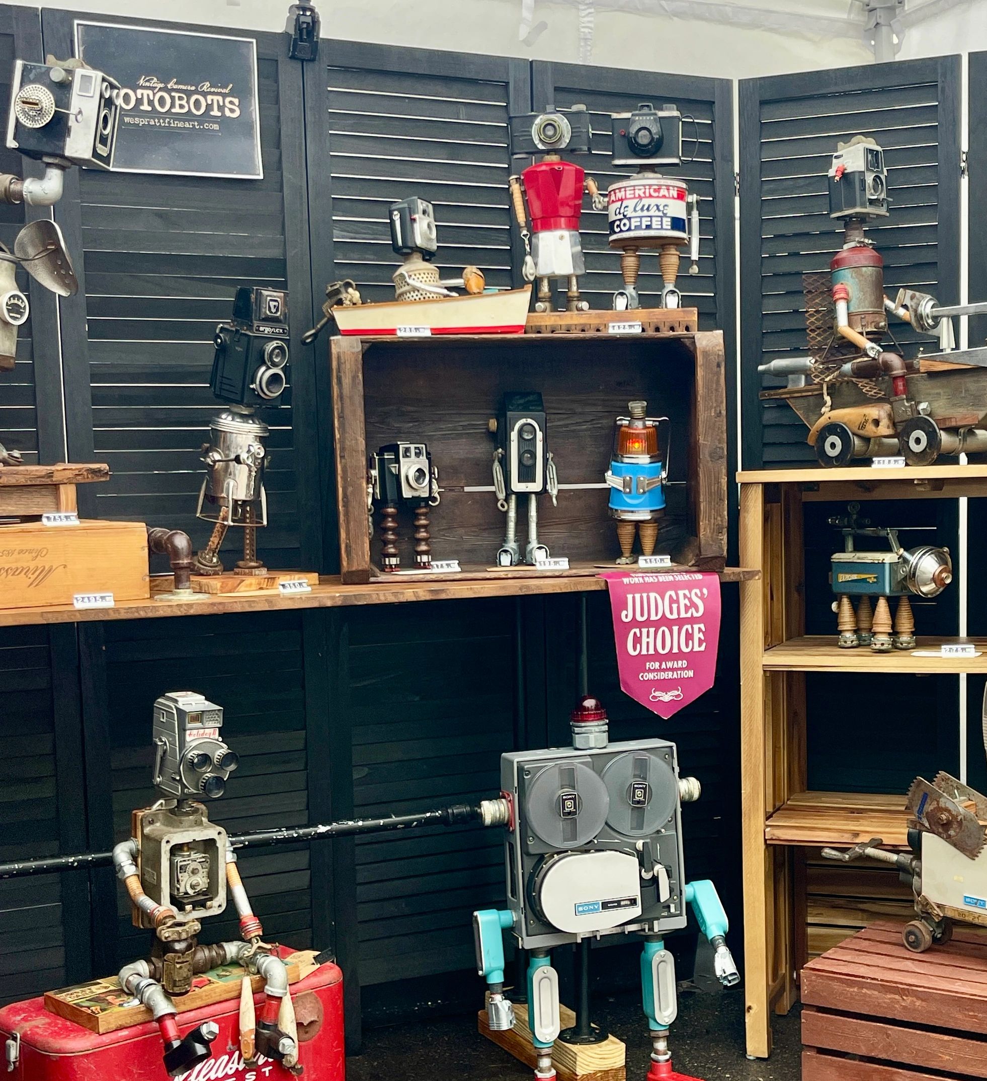 Artistic robots made from vintage cameras and metal parts.