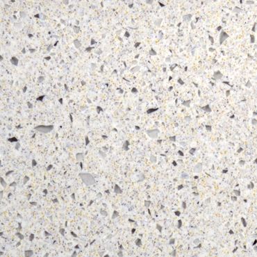 Close-up of a light-colored terrazzo surface with small stone chips.