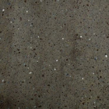 Close-up of a textured concrete surface with small aggregates.