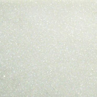 Close-up of a textured white surface with small specks.