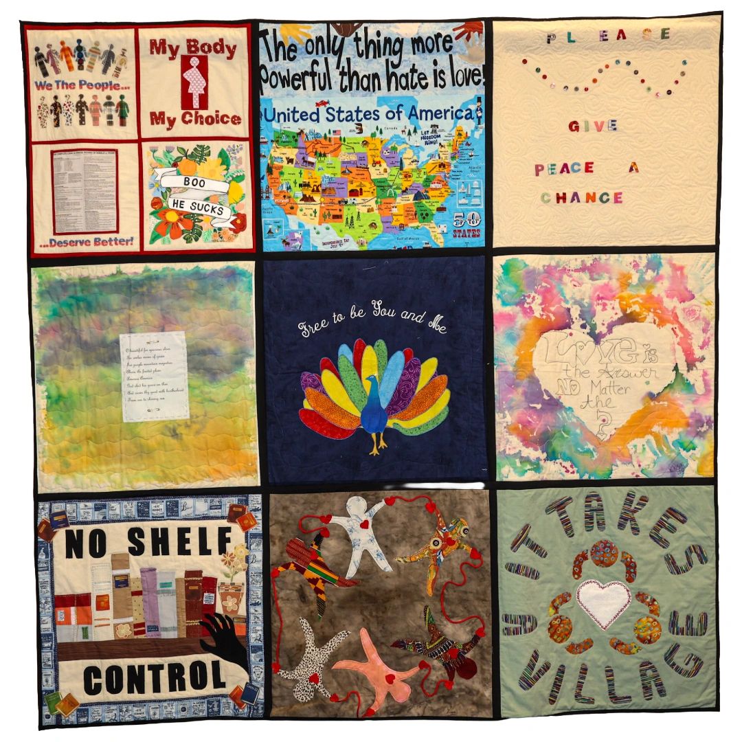 A quilt with colorful panels promoting love, choice, peace, and community.