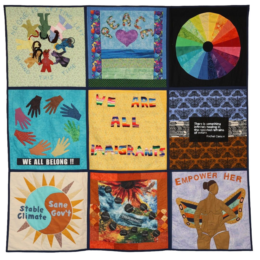 A quilt with diverse patches promoting peace, belonging, climate stability, and empowerment.