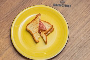 Savor the perfect blend of flavors in our savory salami and cheese sandwich.