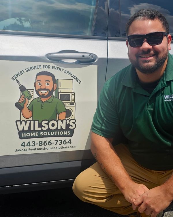 Image of Dakota from Wilson's Home Solutions in front of his vehicle | appliance repair Maryland