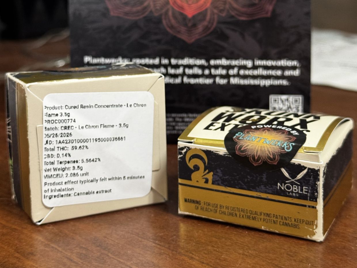 Cannabis concentrate packaging with product details and warning label.
