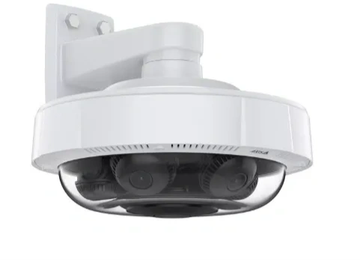White dome security camera mounted on wall.