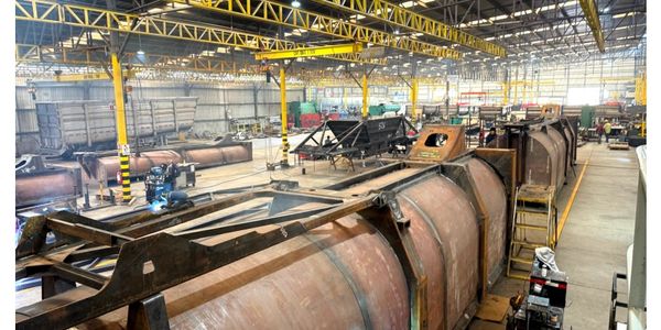 State-of-the-art EXA production floor with trailers moving through build stages.