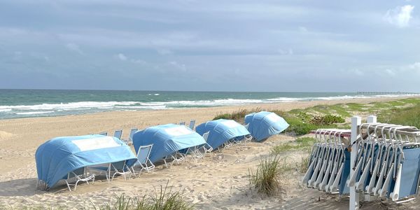 Pale blue cabanas on beach by Ocean, 260 Building, 2600 S Ocean, Palm Beach