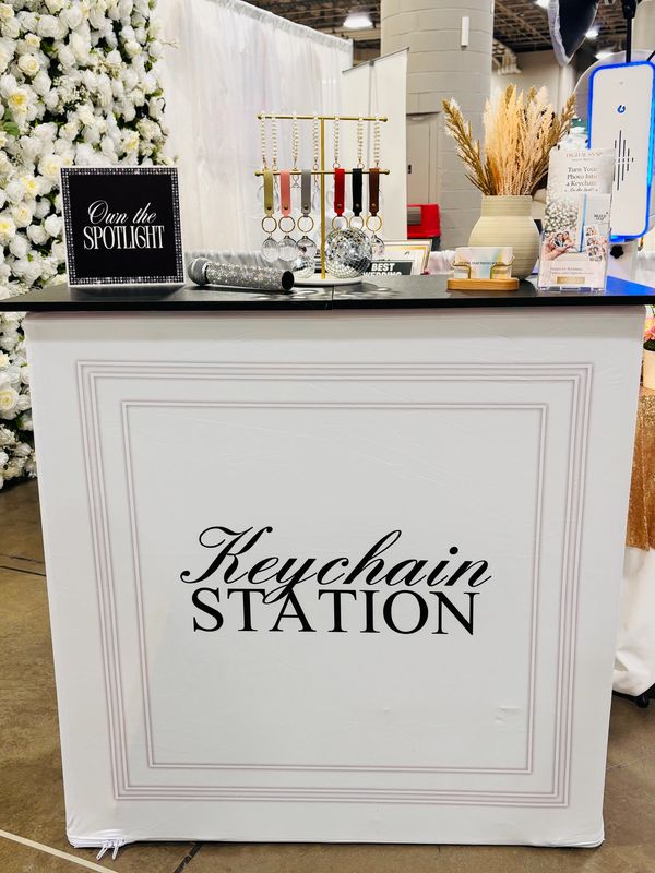 Elegant keychain station at an event with decorative elements.