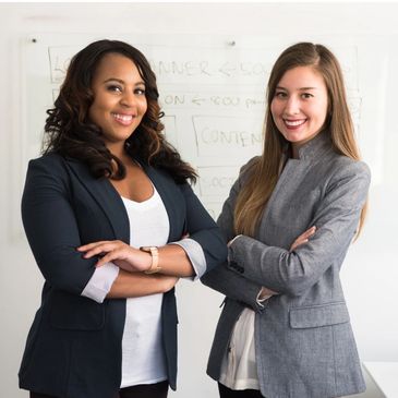 Two professional women standing side by side