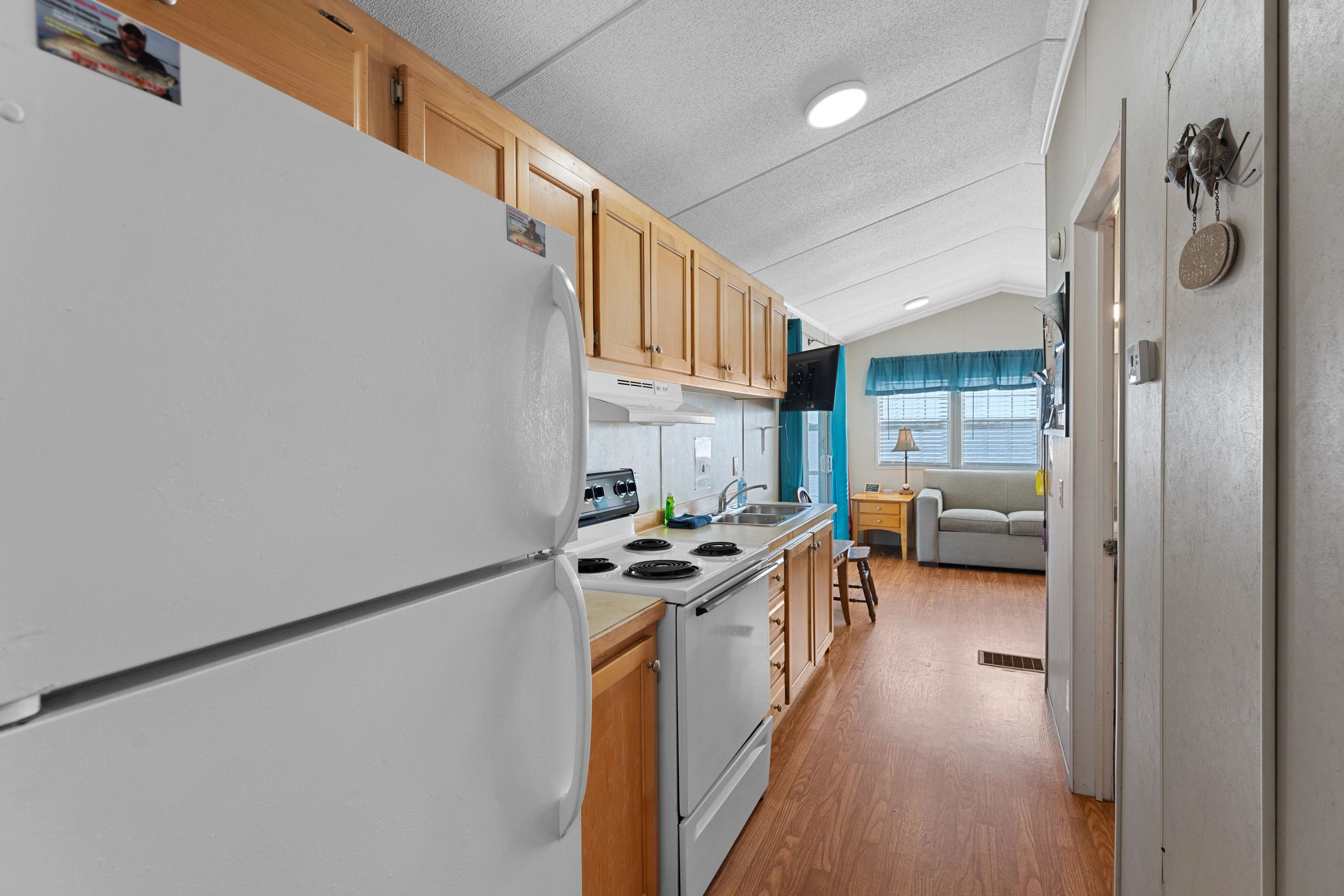 Red Fish cabin galley style kitchen with full size appliances