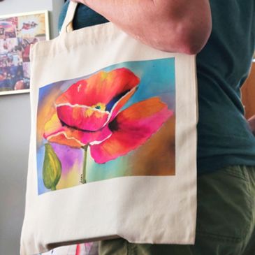 Colorful flower printed on a tote bag.