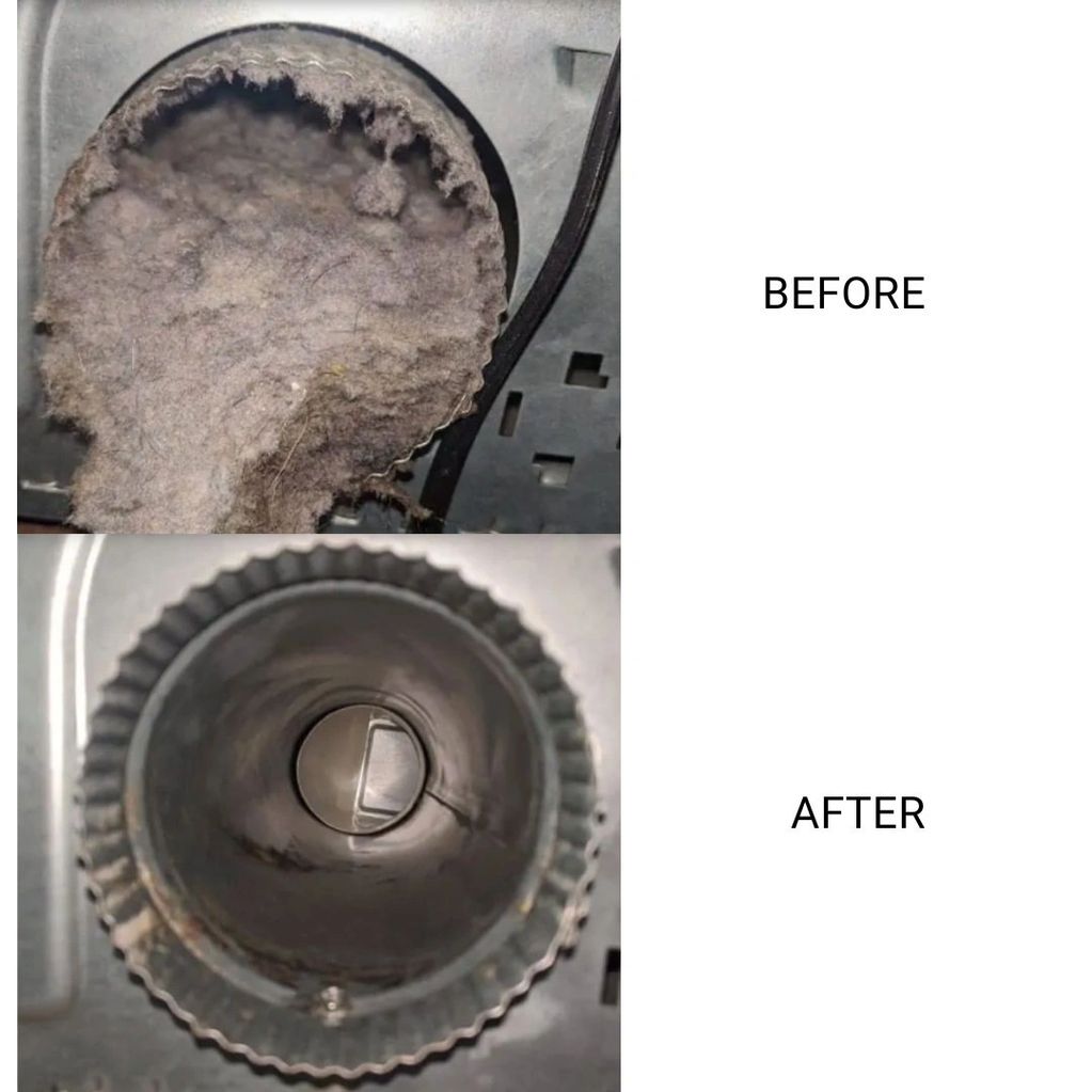 Inside the back of a dryer clogged with lint. 