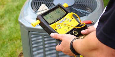 Certified HVAC technician testing performance to ensure optimal cooling efficiency in Polk County,FL