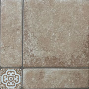 Brown ceramic floor tile with decorative corner tile.