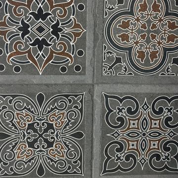 Four ornate patterned tiles with intricate brown, black, and white designs.