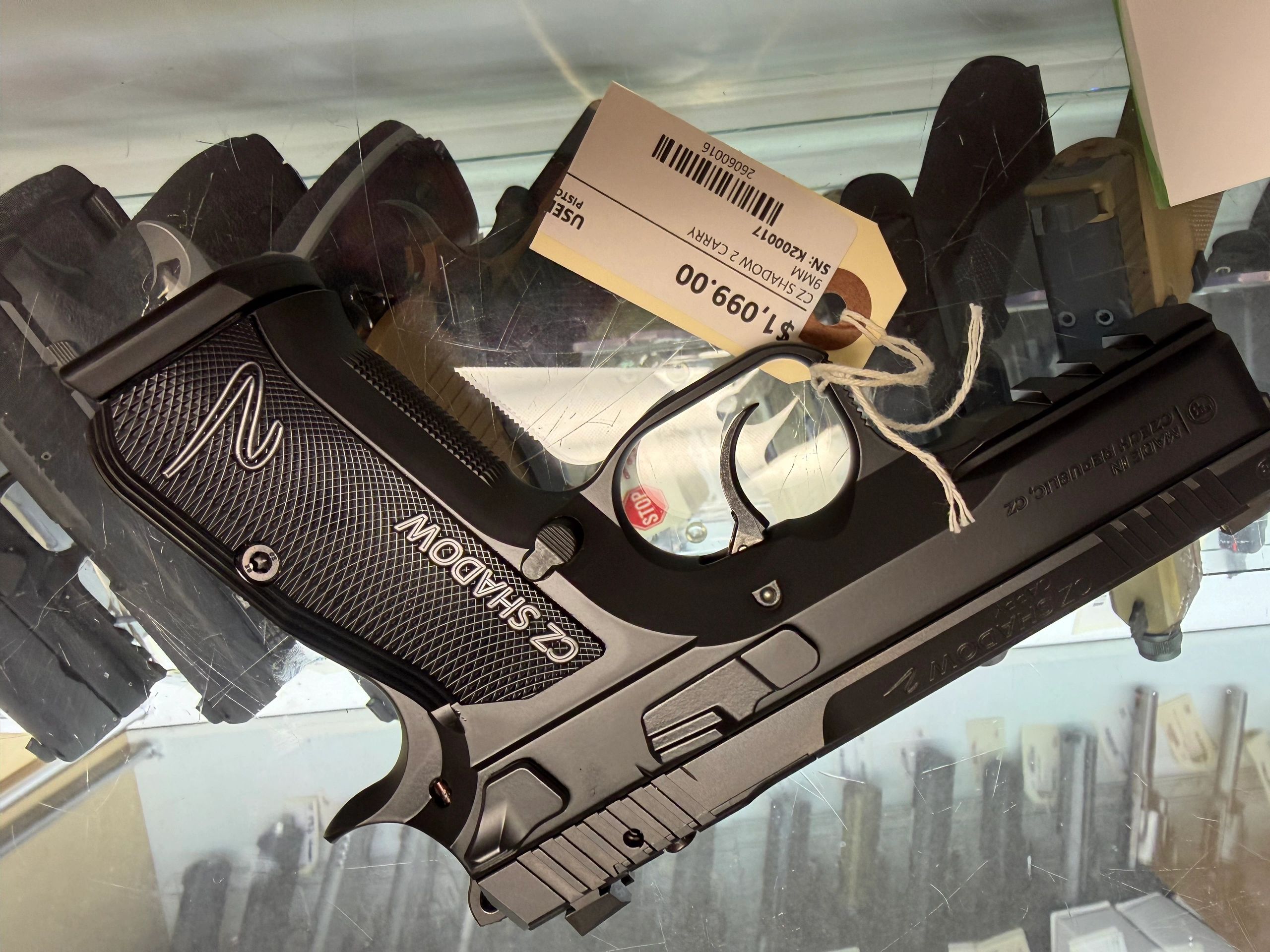 A CZ SHADOW 2 9mm handgun with price tag.