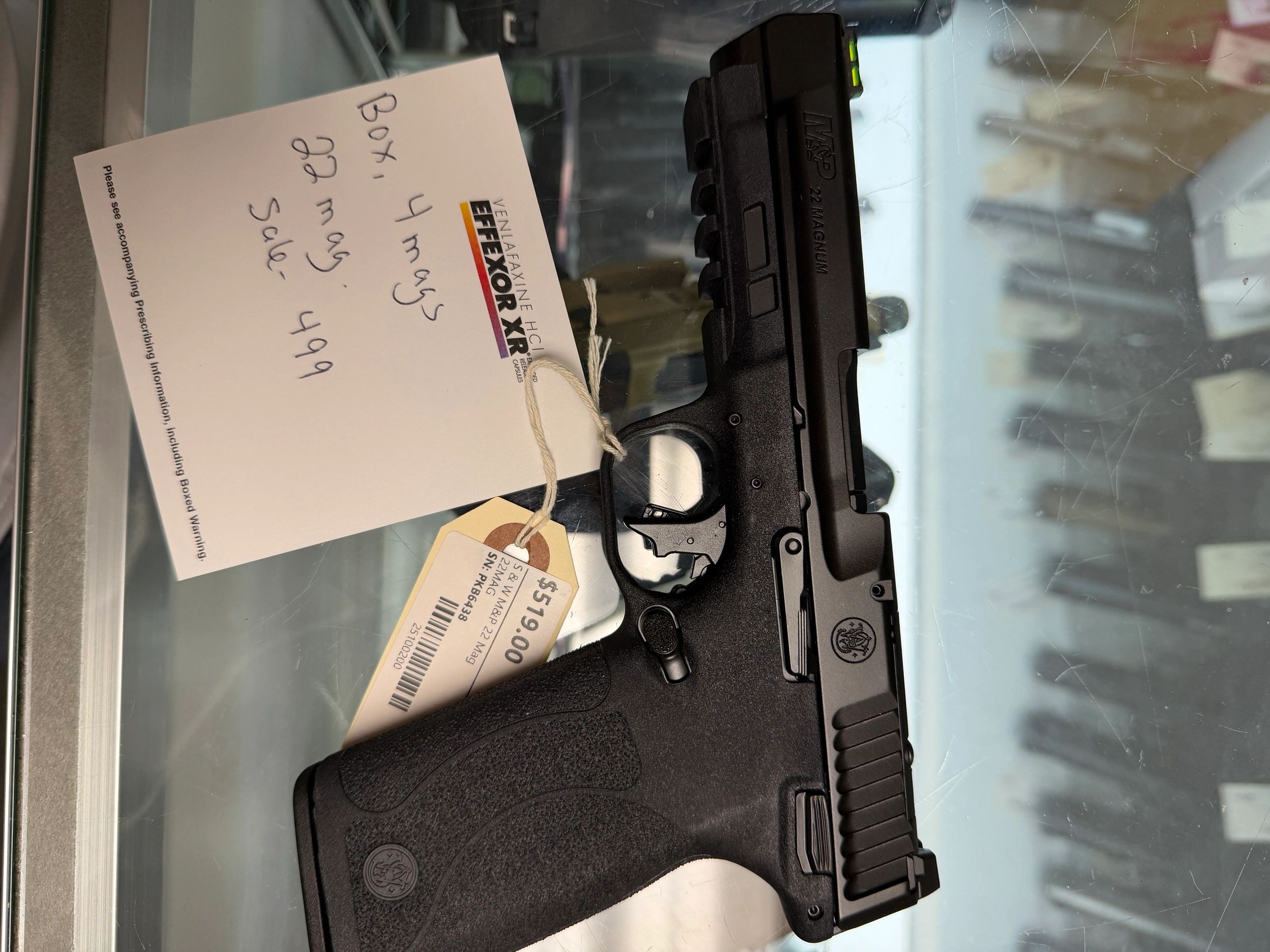 Smith &amp; Wesson .22 Magnum pistol with price tags.