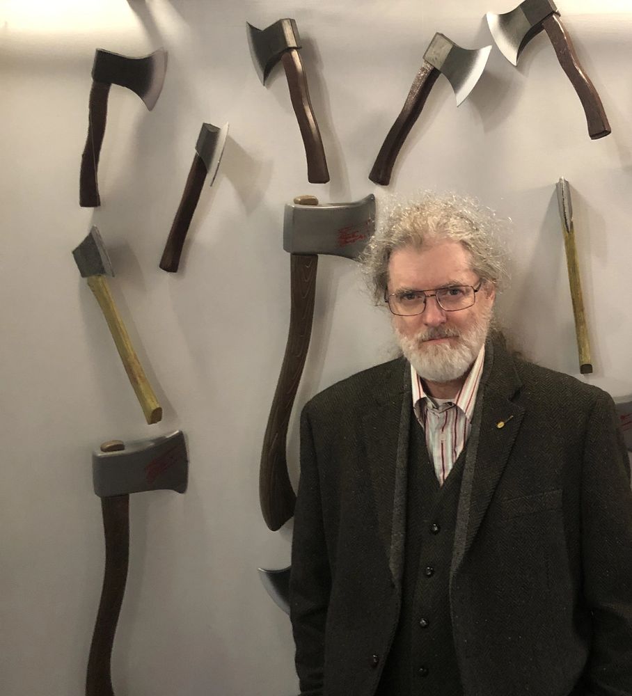 Zakariah in front of a wall of axes. All missed. 