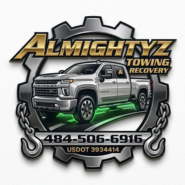 Logo of Almightyz Towing &amp; Recovery featuring a silver Chevrolet truck and contact info.