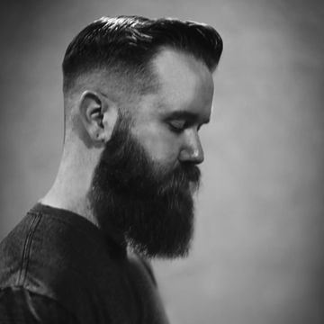 Skin fade men's cut with custom beard trim