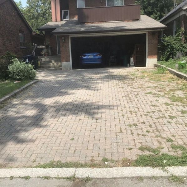 Before power washing  pavers, weeds