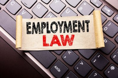 Scroll with Employment Law text on keyboard.