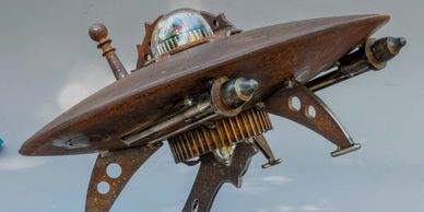 flying saucer - made of upcycled metal and machine parts (about 20" wide)