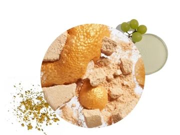A mix of powdered spices and citrus peel with green grapes and a small bowl of powder.