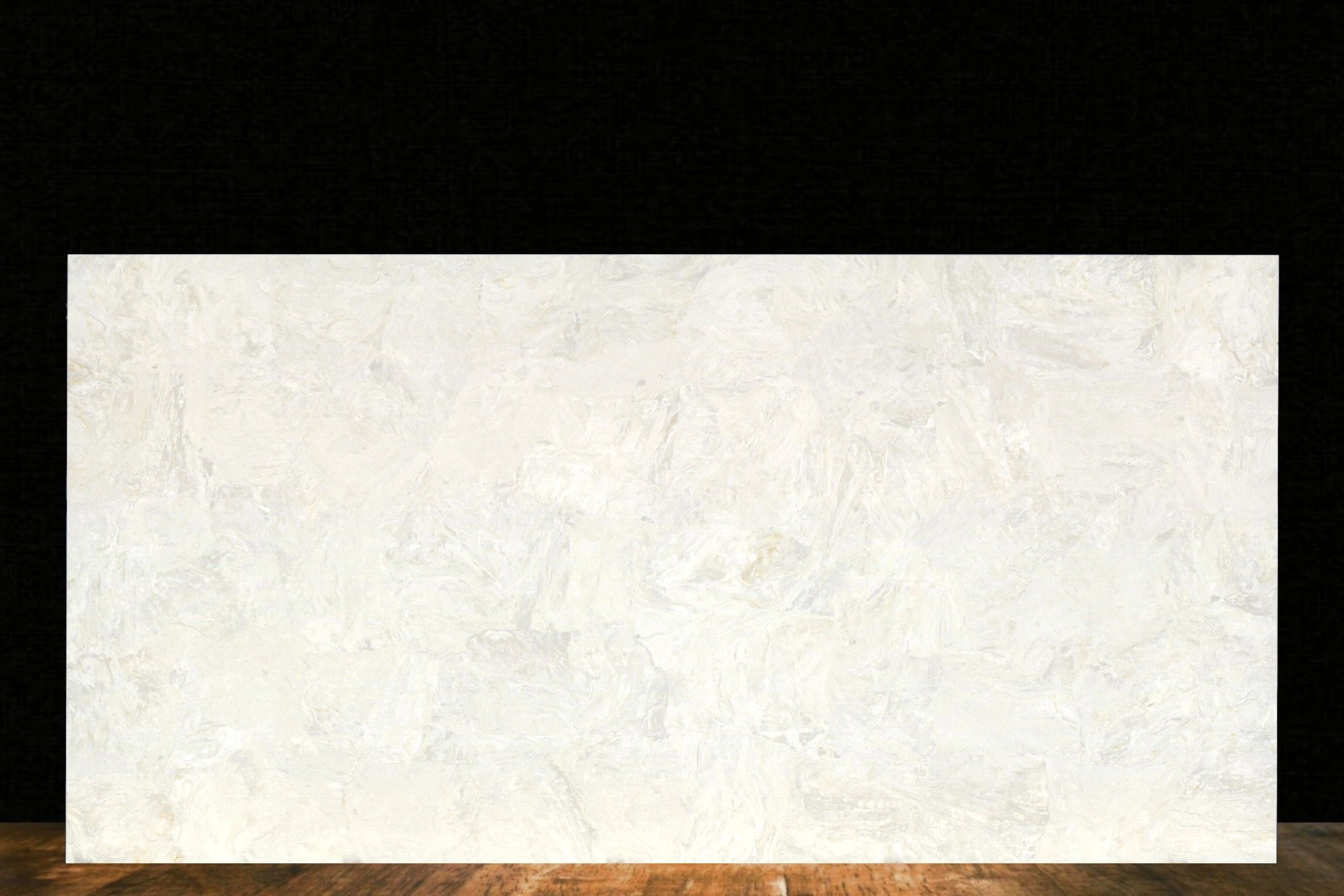 A blank white canvas on an easel against a black backdrop and wooden floor.