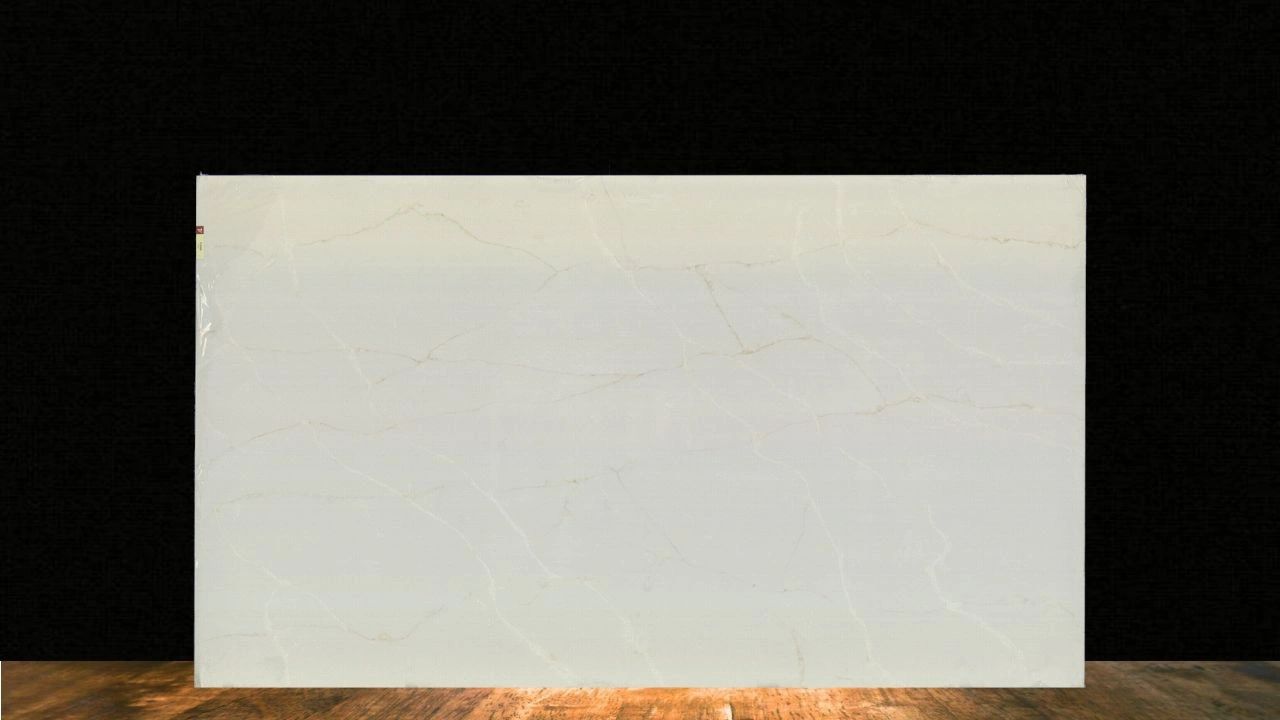 Large white marble slab with subtle beige veins displayed indoors.