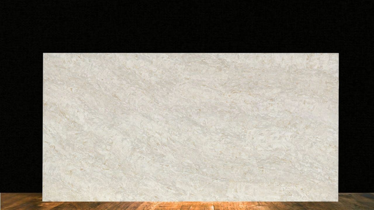 Large beige marble slab on a wooden floor against a black background.