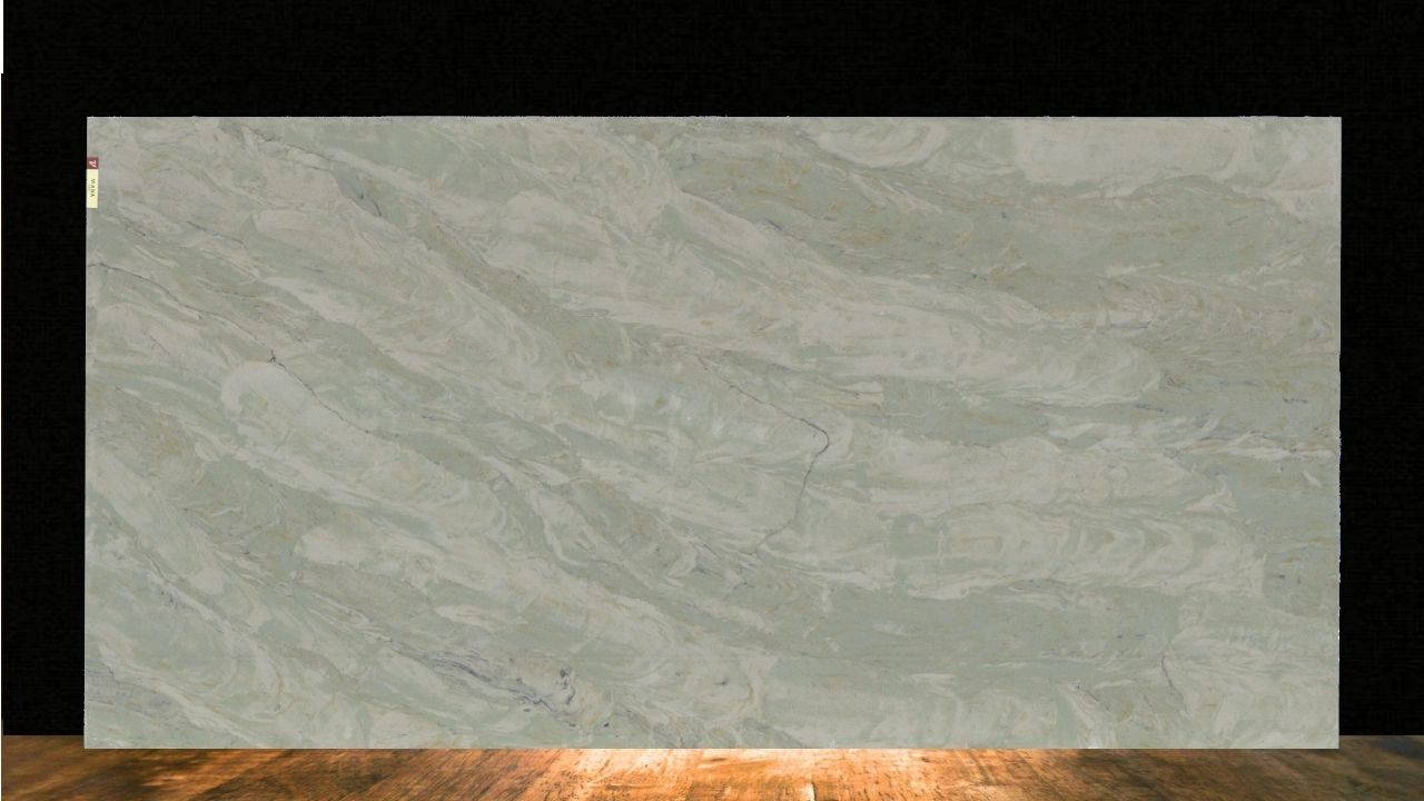Large slab of light gray marble with subtle veining, displayed against a dark background.