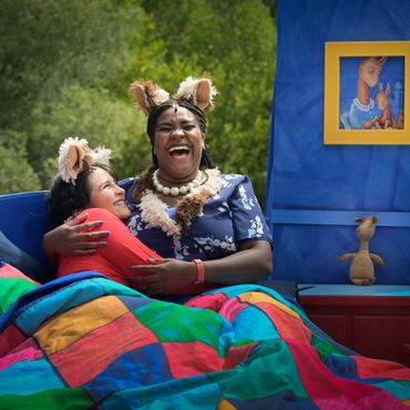 Iyana Colby (dressed as Mama Llama) hugging Leah Sangenitti in Llama Llama Live