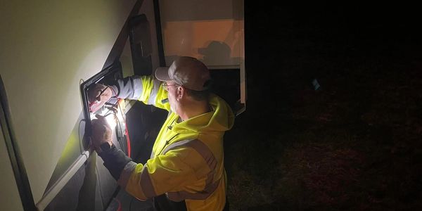 Mobile RV furnace repair by technician during winter night service call in Des Moines - Central Iowa