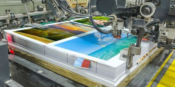 "High-speed offset printing machine in action, ensuring crisp and vibrant prints with precision."!