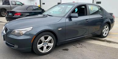 Two BMW cars parked at Devito Racing Compound in Fargo, ND