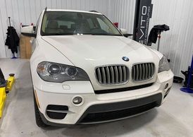 BMW X5 SUV at Devito Racing Compound for expert diagnostics in Fargo, ND. Dealer recommended.