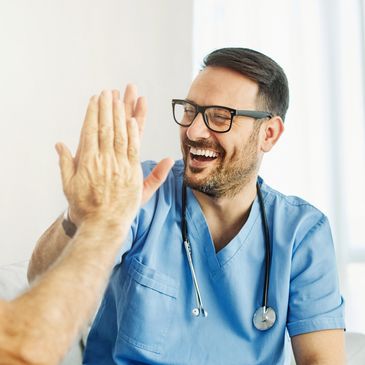 doctor-high-fiving-patient-seeing-success-with-clinical-trials