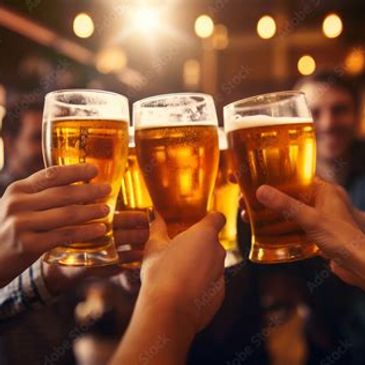 Friends clinking glasses of beer together.
