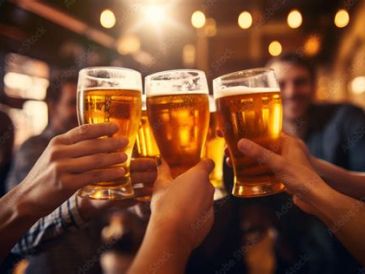 Friends clinking glasses of beer together.