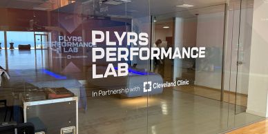 Glass door of PLYRS Performance Lab with Cleveland Clinic partnership.