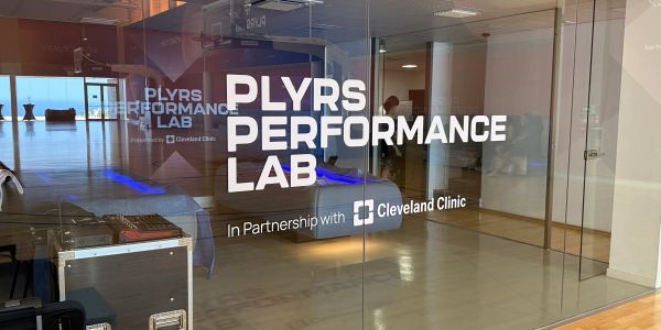 Glass door of PLYRS Performance Lab with Cleveland Clinic partnership.