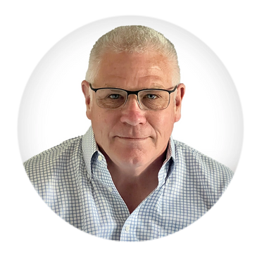 Portrait of a middle-aged man with glasses and a checked shirt.