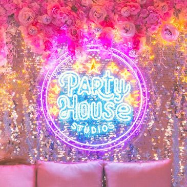 Partyhouse Studios pamper room glowing with pink florals shimmering backdrops and soft lights