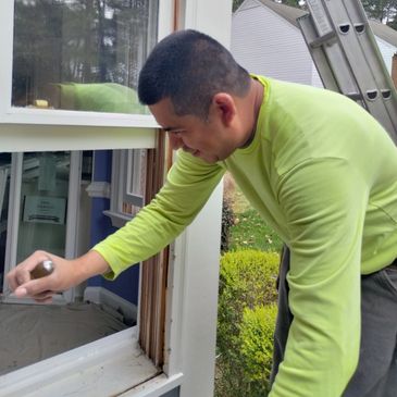 One of Our Highly Talented & Experienced Installers. Demoing an old wood Double Hung Window in Cary,