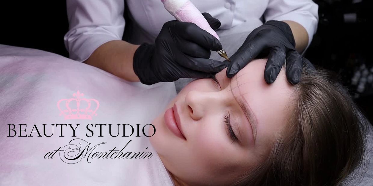 Woman getting eyebrow tattooing at a beauty studio.