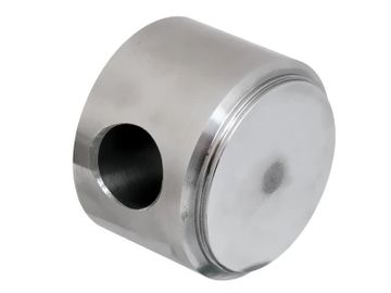 A shiny metal piston with a hollow side hole.